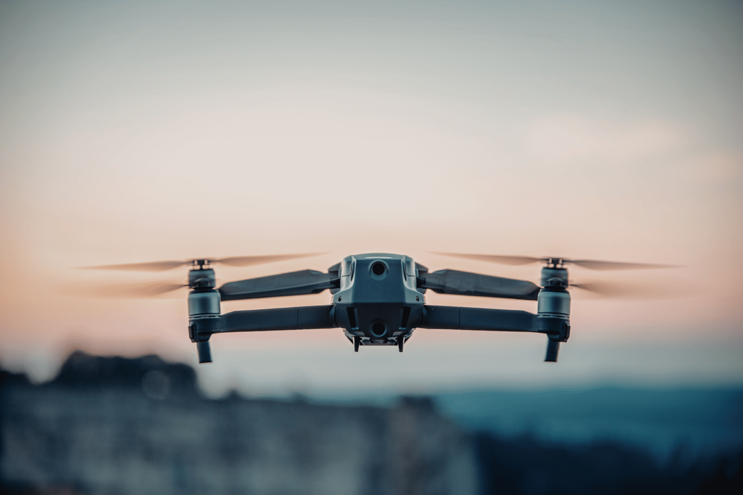 Front view of a drone hovering in the sky.