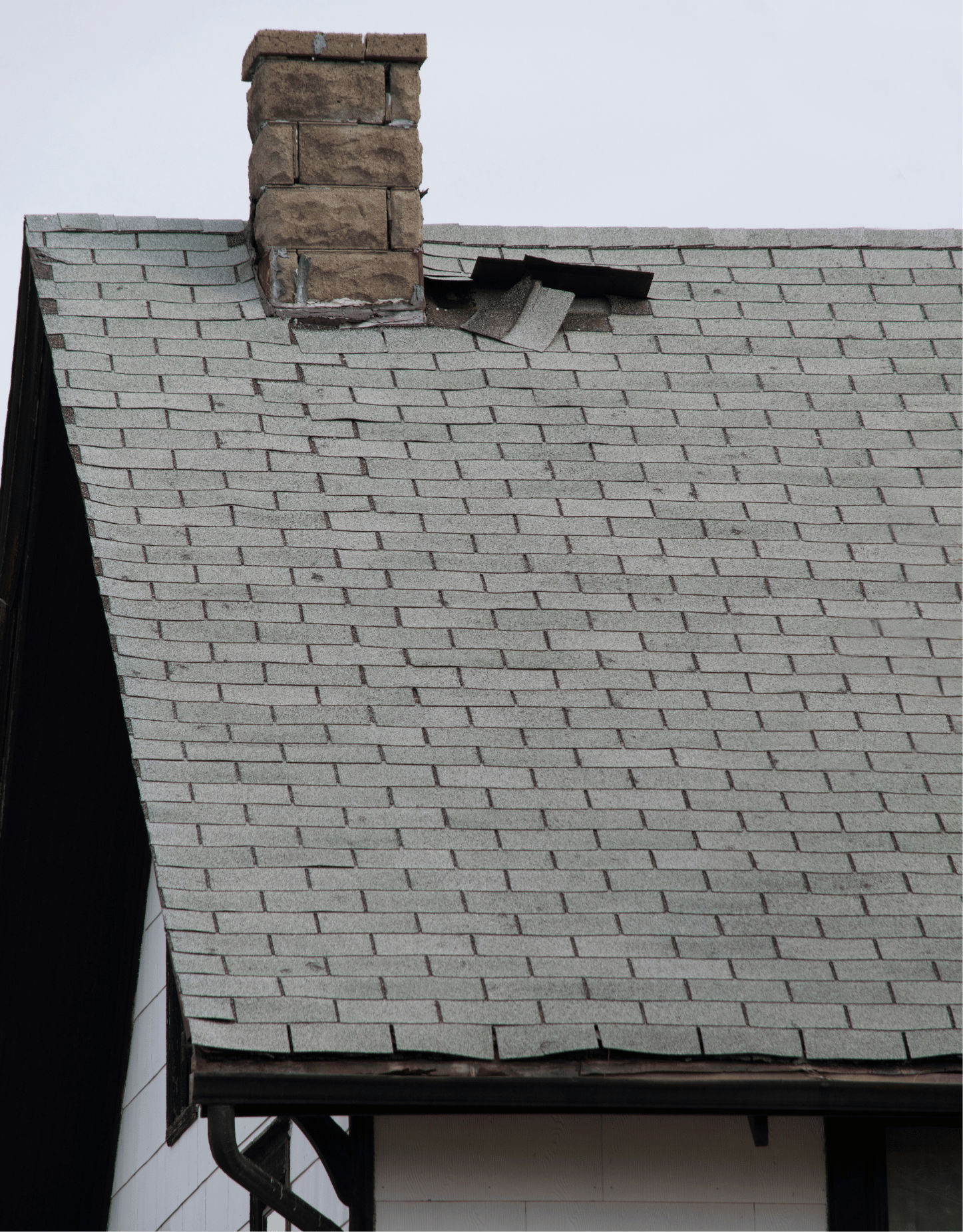 House roof damage where the tiles have come up.