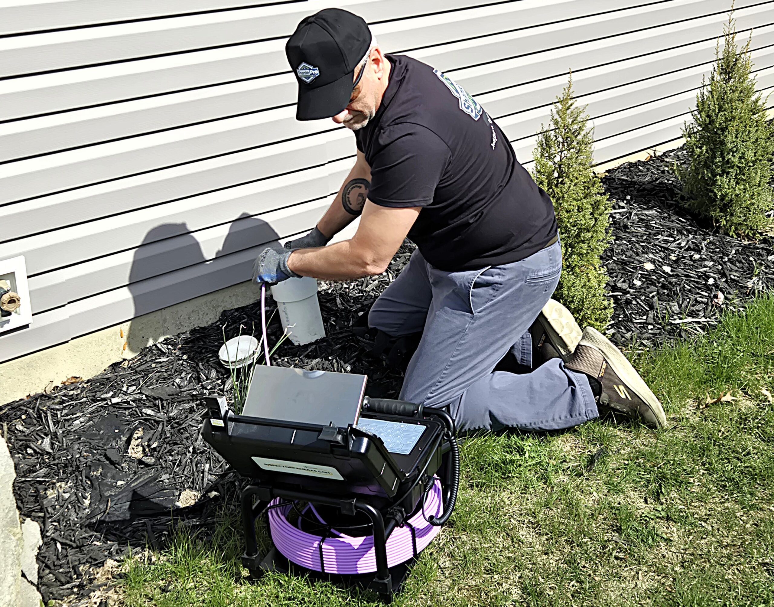 Russ Schanlaub performing a sewer scope inspection for a client's home.